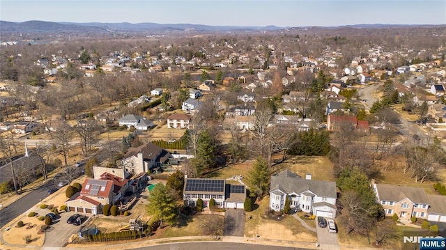 birds eye view of property featuring a mountain view and a residential view