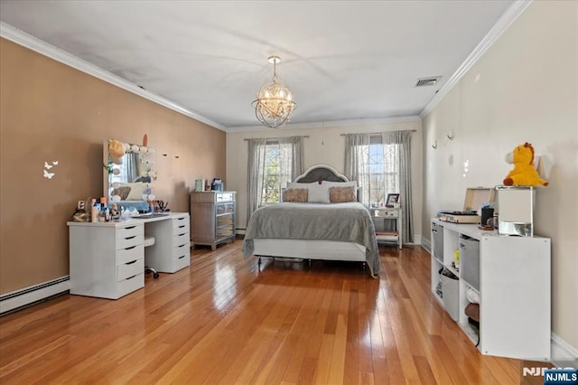 bedroom with a notable chandelier, light wood-style floors, and ornamental molding