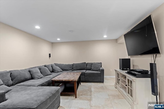 living room featuring recessed lighting and baseboards