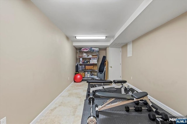 workout room with baseboards