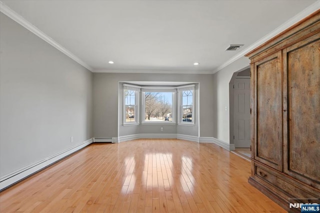 unfurnished bedroom with baseboards, light wood finished floors, visible vents, ornamental molding, and baseboard heating