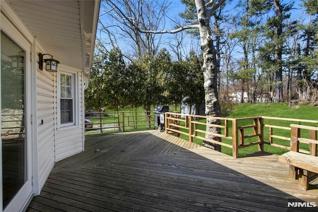 wooden deck with grilling area