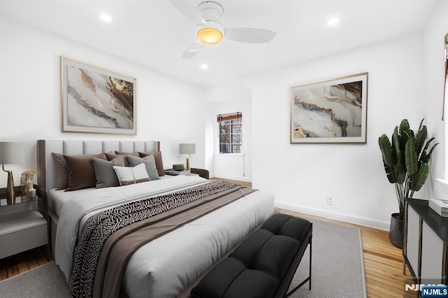 bedroom with recessed lighting, ceiling fan, baseboards, and wood finished floors