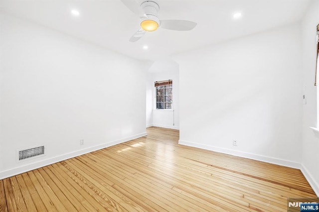 unfurnished room featuring baseboards, visible vents, recessed lighting, ceiling fan, and light wood-style floors