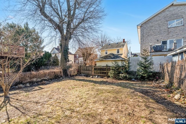 view of yard with fence