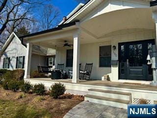 property entrance with covered porch and ceiling fan