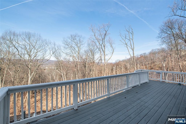 deck featuring a wooded view