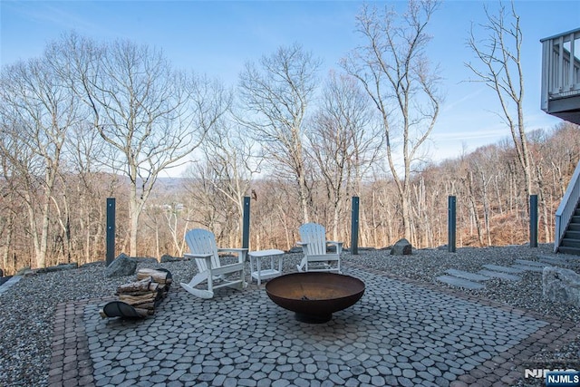 view of yard featuring a patio area and an outdoor fire pit