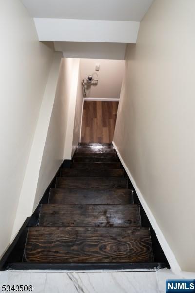 stairway featuring baseboards