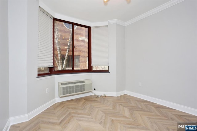 spare room with baseboards, an AC wall unit, and crown molding