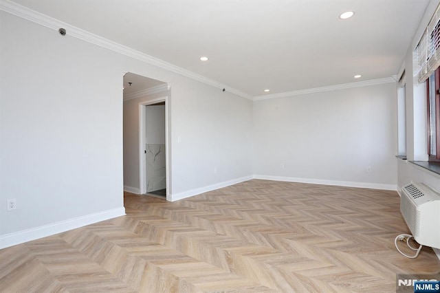 spare room featuring recessed lighting, an AC wall unit, crown molding, and baseboards