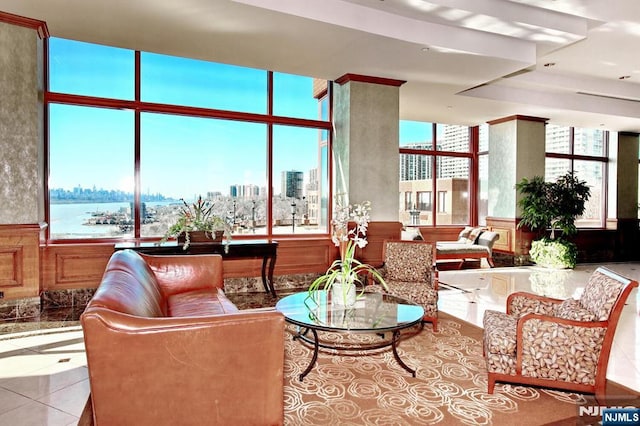 tiled living room with a city view and a wainscoted wall