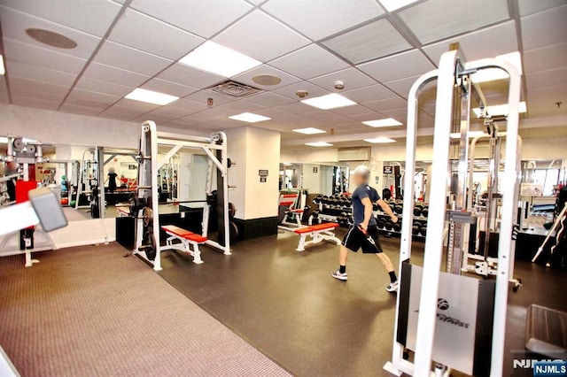 gym with visible vents and a drop ceiling