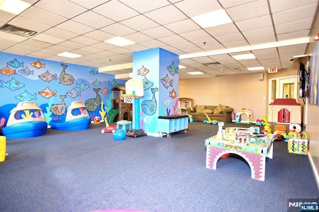 playroom with visible vents and a paneled ceiling