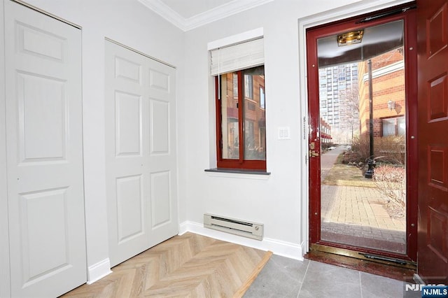 foyer with baseboards, baseboard heating, and ornamental molding