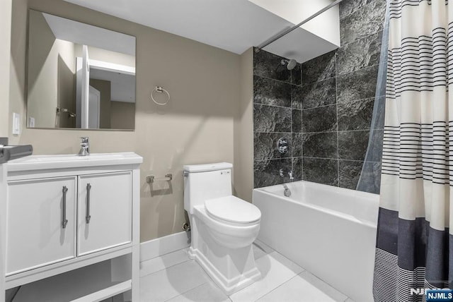 bathroom featuring baseboards, toilet, tile patterned floors, shower / bath combination with curtain, and vanity