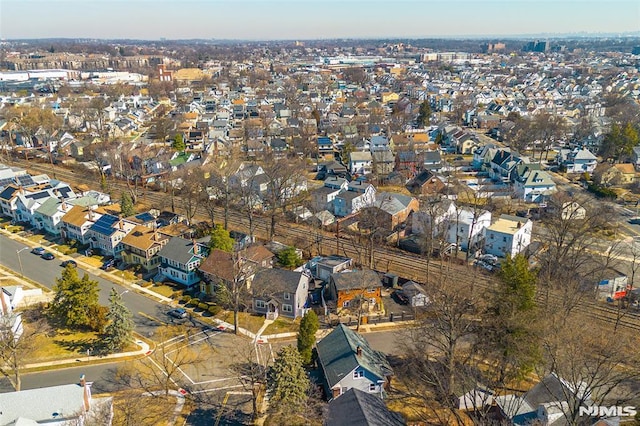 birds eye view of property with a residential view