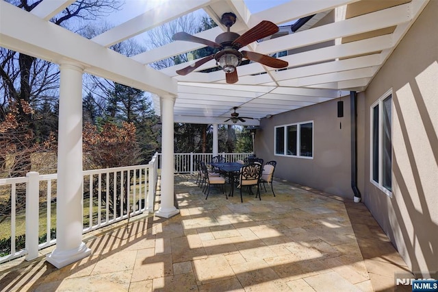 view of patio / terrace featuring outdoor dining space and a ceiling fan