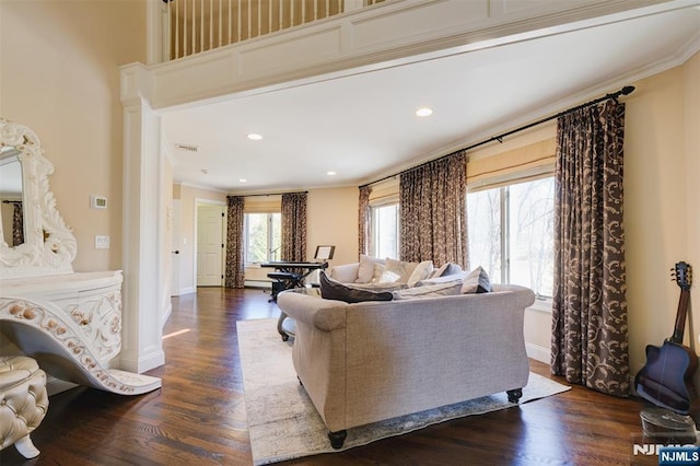 living room with baseboards, dark wood-style flooring, and ornamental molding