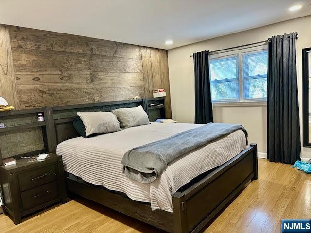 bedroom with light wood-style flooring