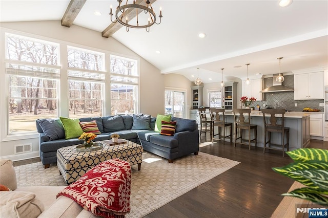 living area with visible vents, dark wood-type flooring, lofted ceiling with beams, recessed lighting, and an inviting chandelier