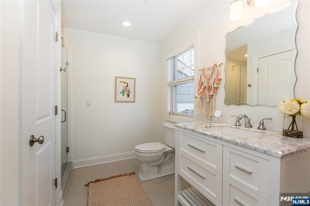 full bathroom with tile patterned flooring, a shower stall, baseboards, toilet, and vanity