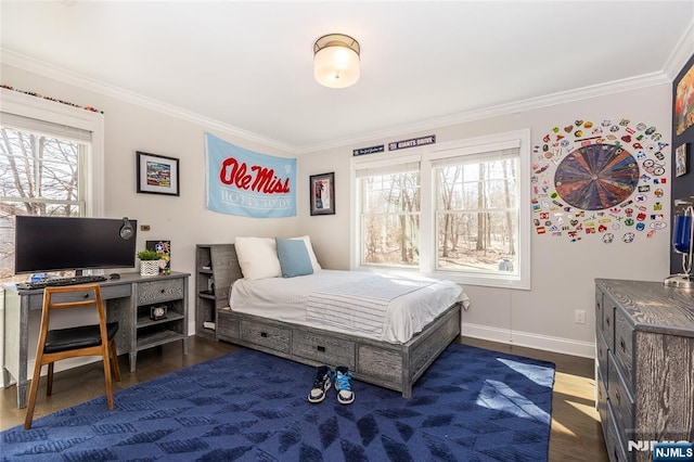 bedroom featuring crown molding, multiple windows, and wood finished floors