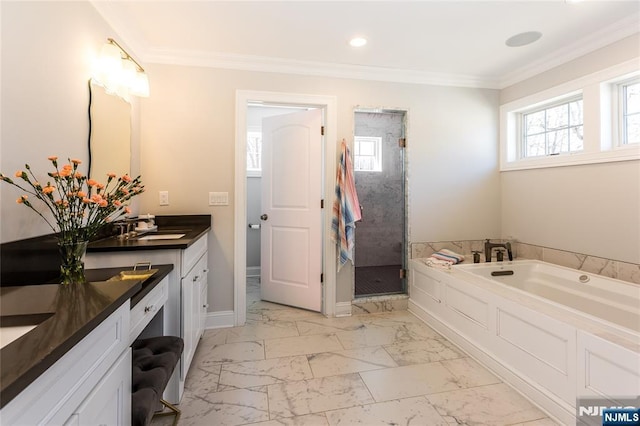 full bathroom featuring crown molding, a garden tub, marble finish floor, and a stall shower