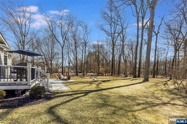 view of yard with a deck