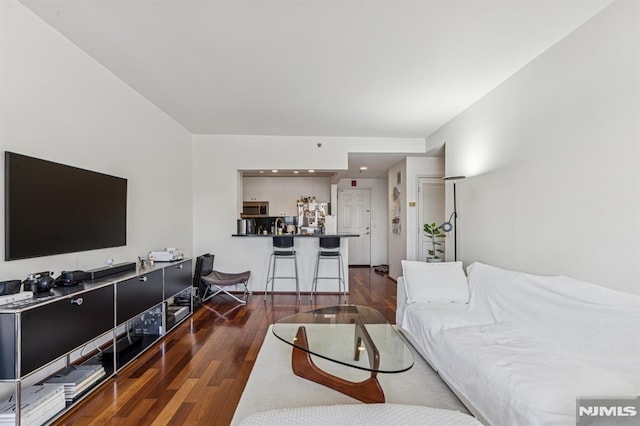 living area with wood finished floors