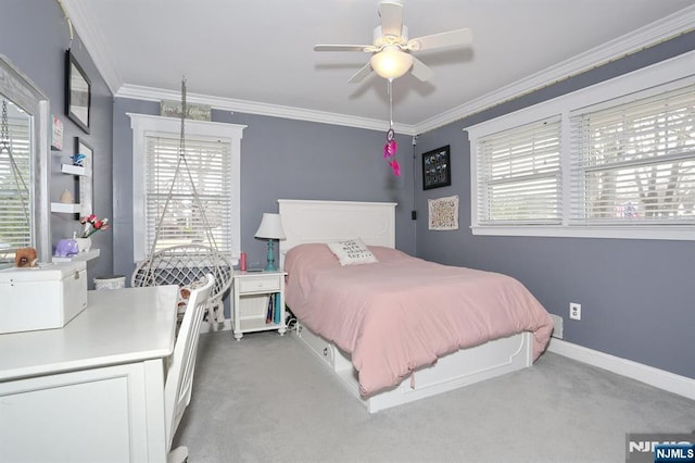 bedroom featuring multiple windows, crown molding, and carpet