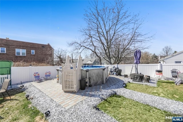 view of patio featuring a fenced in pool and a fenced backyard