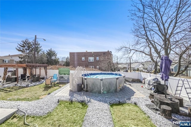 view of yard featuring a fenced backyard, a fenced in pool, a pergola, and a patio