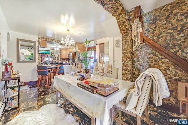 dining area featuring a notable chandelier