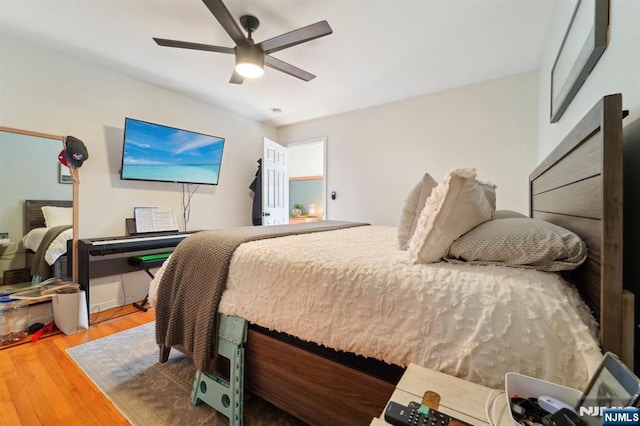 bedroom with ceiling fan and wood finished floors