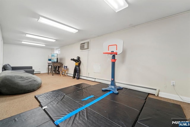 workout area featuring baseboard heating, baseboards, a wall unit AC, and carpet floors