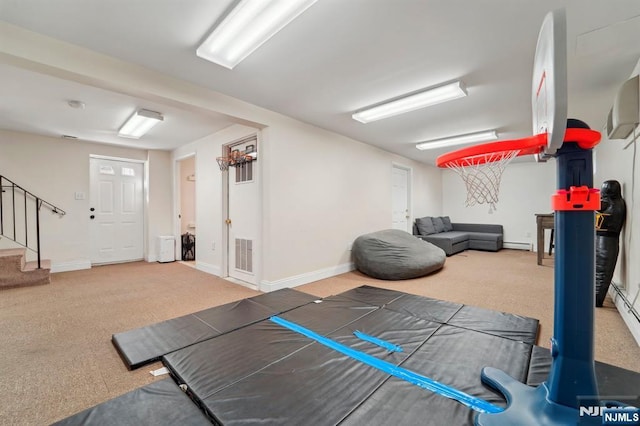 workout area with visible vents, baseboards, carpet, and baseboard heating