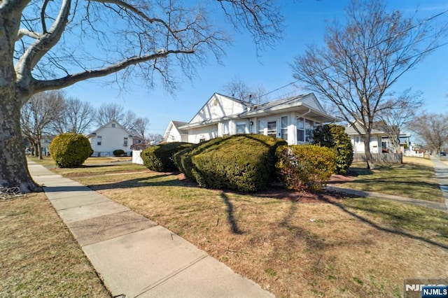 view of side of property featuring a yard