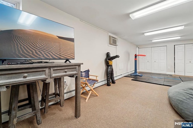 exercise area featuring carpet floors and a wall mounted AC