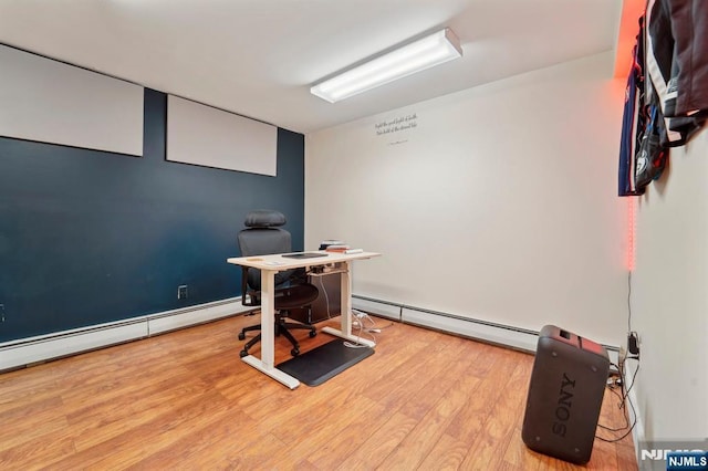 office space featuring wood finished floors and baseboard heating