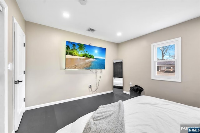 bedroom with wood finished floors, recessed lighting, baseboards, and visible vents