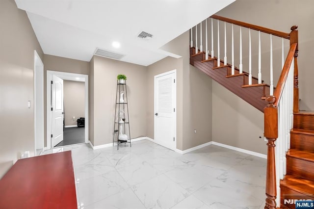 interior space featuring recessed lighting, visible vents, marble finish floor, and baseboards