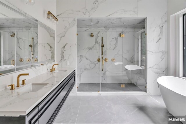 16 Donnybrook Dr, Demarest, NJ 07627 - bathroom featuring marble look tiles, double vanity, a freestanding bath, and a marble finish shower