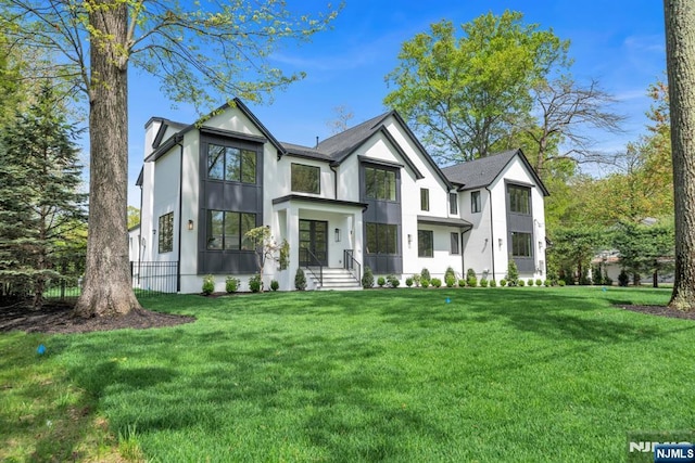 16 Donnybrook Dr, Demarest, NJ 07627 - view of front of house with a front yard and stucco siding