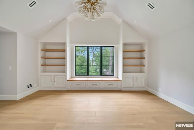16 Donnybrook Dr, Demarest, NJ 07627 - bonus room featuring built in shelves, light wood-style floors, a chandelier, vaulted ceiling, and baseboards
