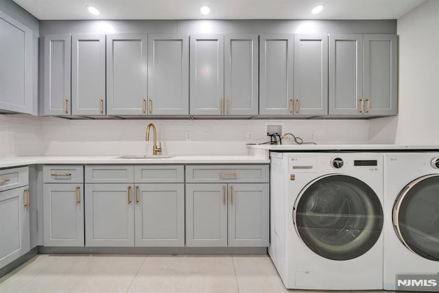 16 Donnybrook Dr, Demarest, NJ 07627 - laundry room with cabinet space, washing machine and dryer, light tile patterned floors, and recessed lighting