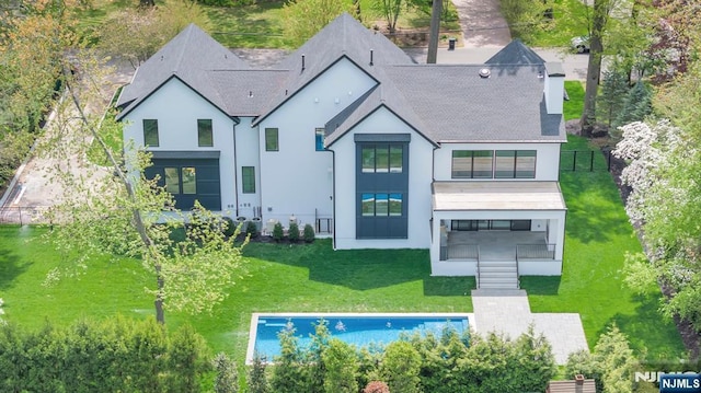 16 Donnybrook Dr, Demarest, NJ 07627 - rear view of house featuring stucco siding and roof with shingles