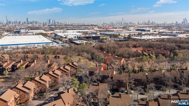 drone / aerial view featuring a city view