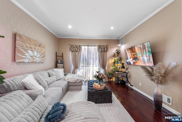 living area with visible vents, baseboards, wood-type flooring, and crown molding