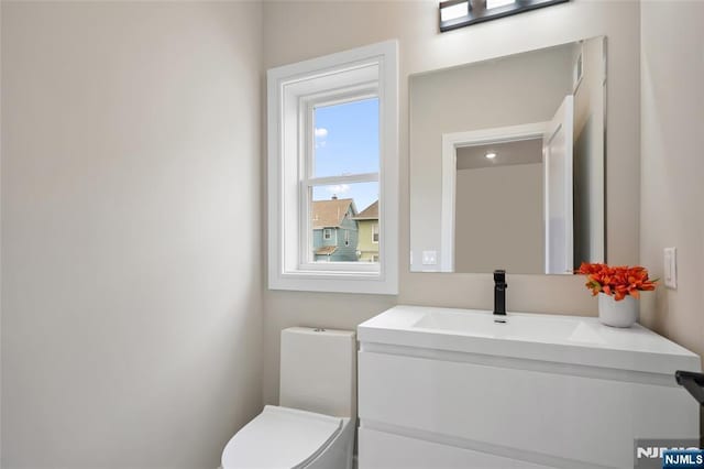 bathroom with vanity and toilet